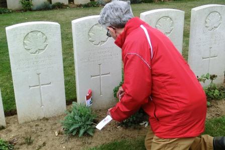 CIMG8557 Sep 6 2017 Pieter places flags by grave of James Cairns at Manitoba Cemetery