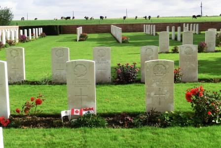 CIMG8671 Sep 9 2017 Chester Farm Military Cemetery with cows in backgroung flags by Camerons grave
