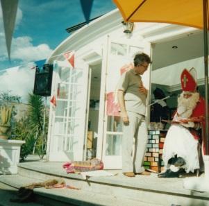 #12 Dec 2000 La Paz Bolivia Sinterklaas checks whether Pieter is in the good book or bad book