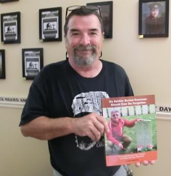 CIMG5757 Aug 11 2022 Mario Henry with book