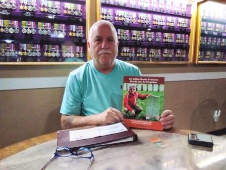 20230918_124503 Sep 18 2023 Malcolm John Pres Richibuctu Legion with book