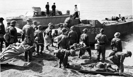 Loading-wounded-on-landing-craft.-Source-Global-News-768x447